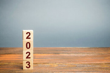 Wooden blocks with the inscription 2023. Setting goals and objectives for the new year. Planning,...