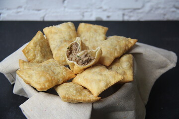 Brazilian food. Pastel, pastel in English, typical dish from the open markets of southeastern Brazil, fried and stuffed with meat. Mini pastries.