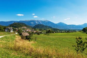 Fototapeta na wymiar Rural Landscape and Alps in Upper Carniola (Gorenjska) near the small village of Zgornje Gorje, Gorje municipality, Triglav National Park, Slovenia, Europe.
