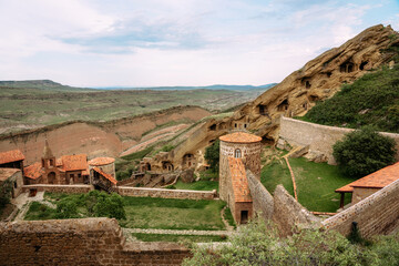 View of David Gareja Lavra orthodox monastery caves built in rock Georgia in semi-desert.  - 529466316