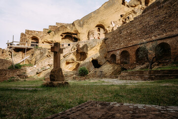 View of David Gareja Lavra orthodox monastery caves built in rock Georgia in semi-desert.  - 529466513