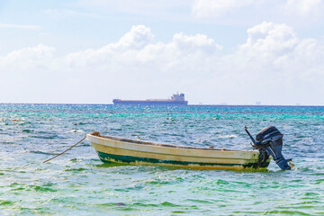 Boats yachts container ship beach in Playa del Carmen Mexico.