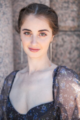 Close up portrait of a young beautiful girl in summer park