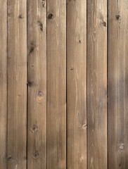 Vertical wooden planks with knots. Wooden background.