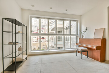 Modern Home With piano next to a window