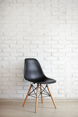 chair over white brick wall background