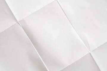 White folded and wrinkled paper texture background