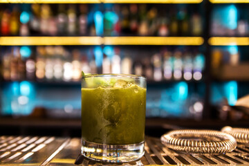 Green cocktail witn rum and mint, selective focus
