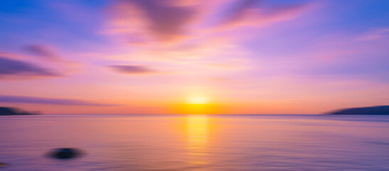 Naklejka na ściany i meble Blurred sea background at sunset, Abstract natural background and texture motion blur,panoramic view of sunrise over ocean.Dark sky sunlight and deep dark water sea background