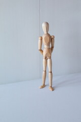 Concept of waiting to stand or rest on the street with a wooden doll as a model