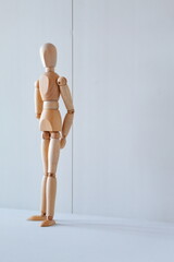 Concept of waiting to stand or rest on the street with a wooden doll as a model
