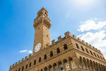 Fototapeta premium Florence, Italy. The Old Palace tower - named Palazzo Vecchio - with blue sky. Copy space, nobody.