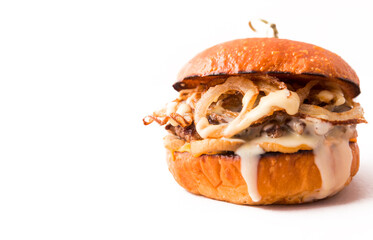 Burger with beef cutlet under tender cream cheese with champignons and onion chips on a white background