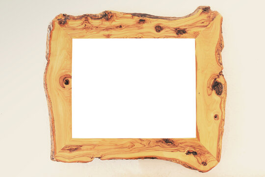 A picture frame made of wood, irregular borders, containing an empty rectangle (isolated cutout space).
