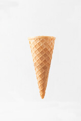 Waffle ice cream cone isolated on white background.