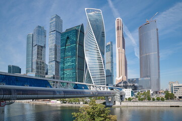 Moscow, Russia - August 12, 2022: Towers of the Moscow International Business Center "Moscow-City" and the shopping and pedestrian bridge "Bagration"