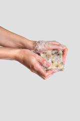 Woman holding handcrafted soap. Soap to wash hands, concept of hygiene to protective pandemic coronavirus. Spa products