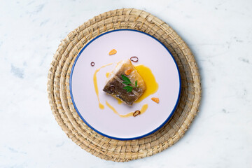 Bacalao al pil pil traditional tapa from the north of Spain. Coconut fish cooked with a delicious...