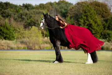 Woman on a horse in a red dress © Terri Cage 