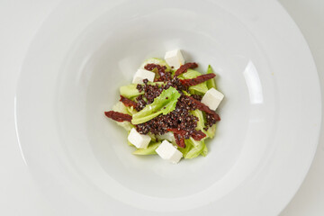 piece of fresh lettuce, sun-dried tomatoes, feto cheese