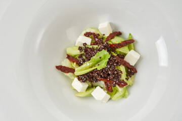 piece of fresh lettuce, sun-dried tomatoes, feto cheese