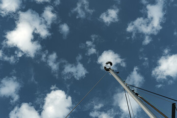 thunder paratoner on sail boat mast view in cloudy sky, lighting protection on board