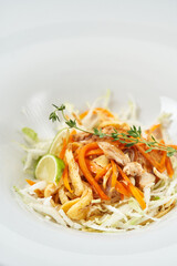 salad with vegetables and fruits. cabbage, markov, apple, lemon. dressing olive oil with lemon and mustard