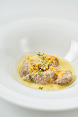 pork slices with sour cream sauce with vegetables