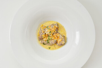 pork slices with sour cream sauce with vegetables