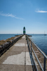 pier in the sea with lighthouse