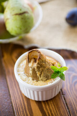 pear baked in curd dough in a small ceramic form