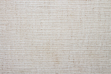 The texture of the canvas fabric.Old rag background. A rag for washing floors.Background of a canvas rag.