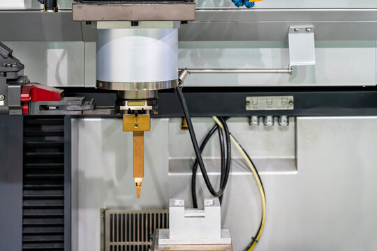 close up copper electrode during setup on automatic electrical discharge machine (edm) or spark machining