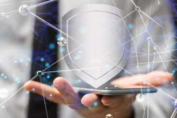 shield protection concept holding in hand