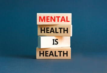 Mental health psychological symbol. Concept words Mental health is health on wooden blocks on a...
