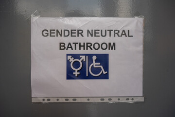 a tag on the door signifying a gender-neutral toilet