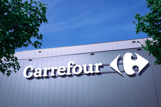 Poznan, Poland - September 9, 2022. Carrefour logo on a shopping center - Carrefour is a French multinational corporation operating over 12 000 hypermarkets and stores.