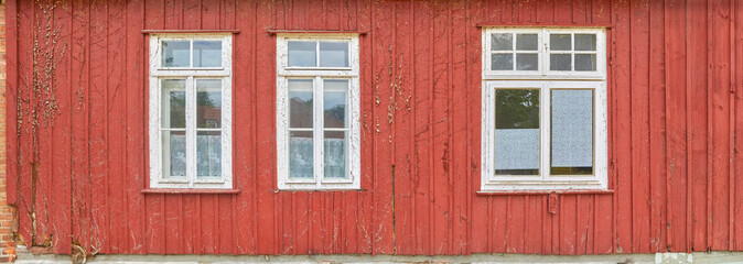 Naklejka premium Beautiful old wooden house with colourful paint.
