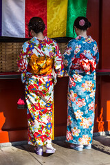 Geishas in buddhist shrine