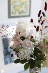 Bouquet with white roses and hydrangeas in the interior