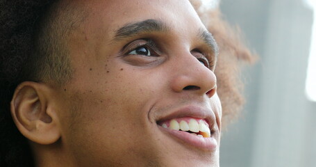 African american black man face opening eyes smiling feeling happy and contemplation