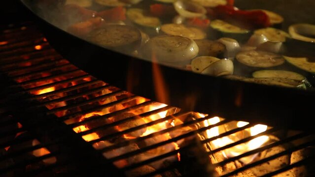 barbecue grill cooking. Vegetarian grilled vegetables, onion paprika and zucchini, courgette over the fire.