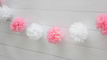 garland of white and pink pompoms