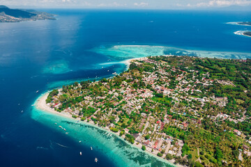 Tropical island with beach and ocean, aerial view. Popular Gili islands