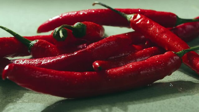 Red Pepper in fire. On wood plank Ripe red long hot chili peppers are the world's number one culinary delight and cash crop in New Mexico, USA, Vietnam, Thailand, Asia.