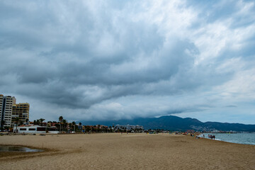 Empuriabrava spanish town beach with cloudy sky Landscape of the catalan town in the Costa Brava region known for its canals and marina