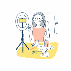 スマホで自分のメイク動画を撮影している女性