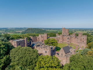 Fototapeta na wymiar Peckforton Castle Cheshire, historic castle in rural Cheshire north west England, United Kingdom. Aerial view of the castle and wedding venue by drone