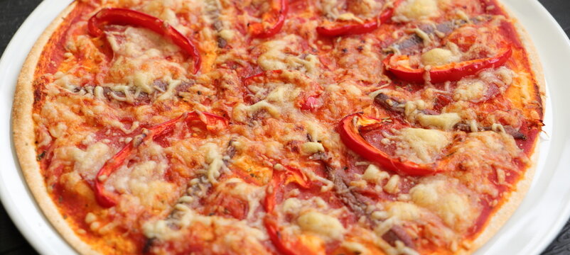Pizza with peppers, anchovies and cheese