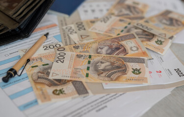 banknotes Polish zloty money with a calendar for paying utility bills